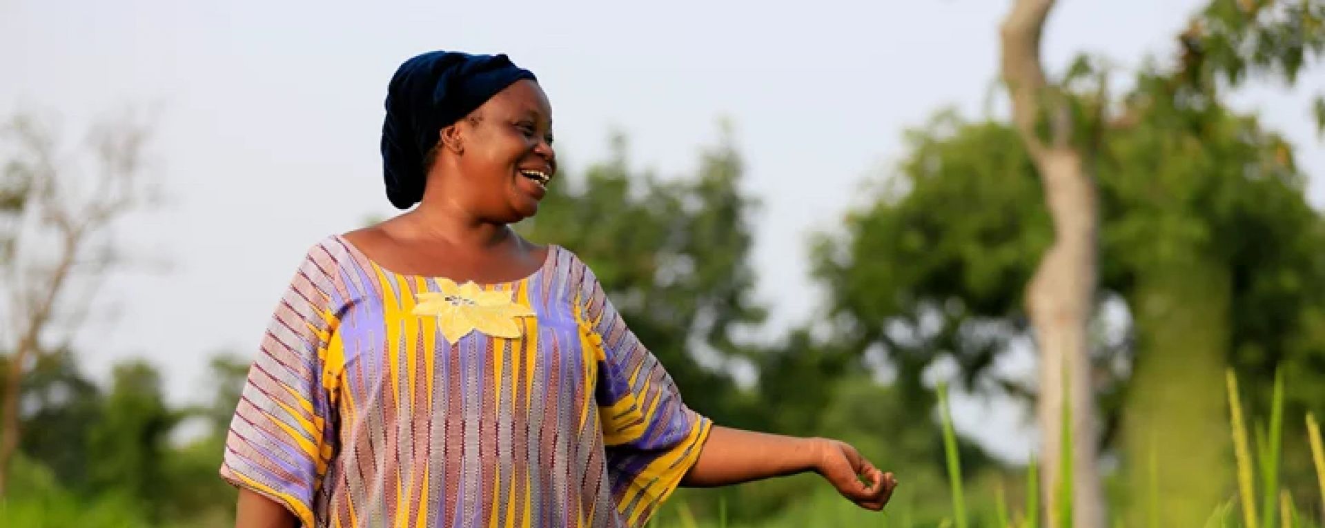 Woman standing in a crop field