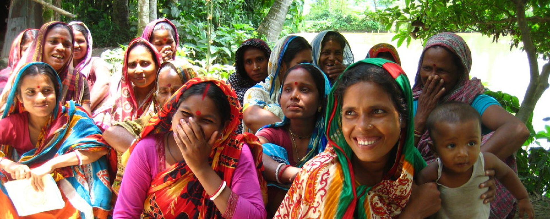 Women smiling with children