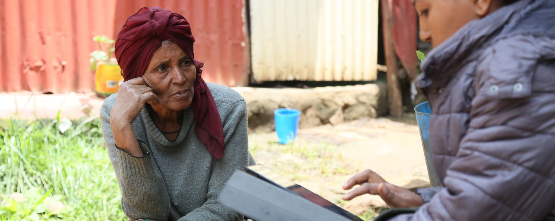 Researcher interviewing woman